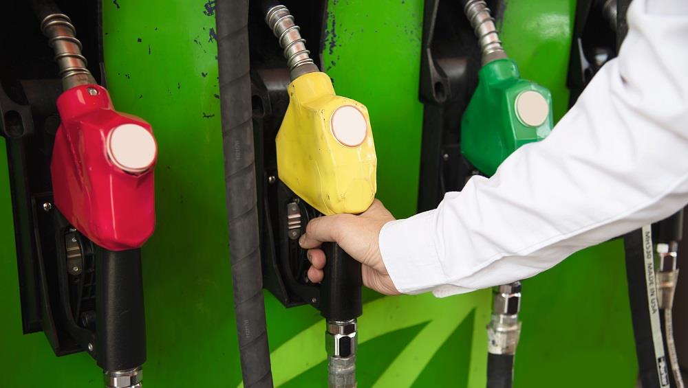 man-putting-gasoline-fuel-into-his-car-pump-gas-station